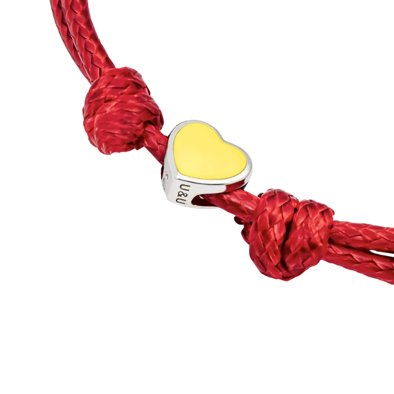 Браслет на шнурку Україна з серцем із жовтою емаллю фото