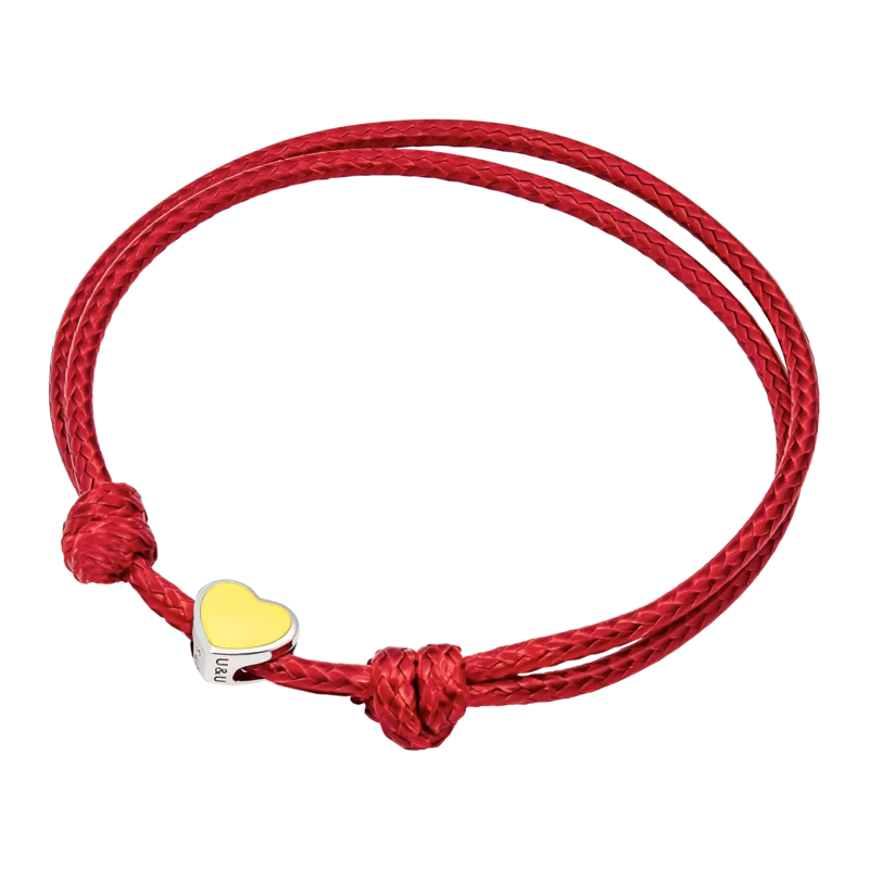 Браслет на шнурку Україна з серцем із жовтою емаллю фото