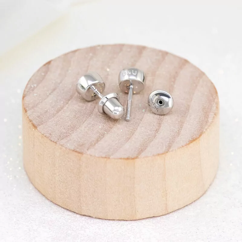 Silver screw back for stud earrings photo